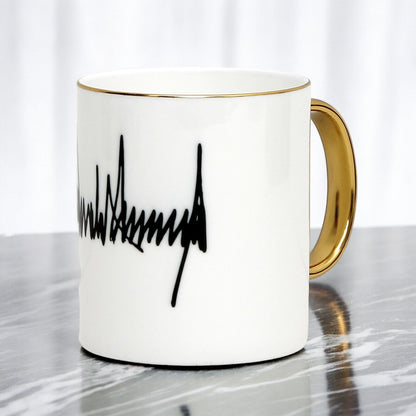 The ultimate Luxury Trump Signature Mug! A genuine Bone China Mug, featuring a gold handle and rim. (11 Oz)