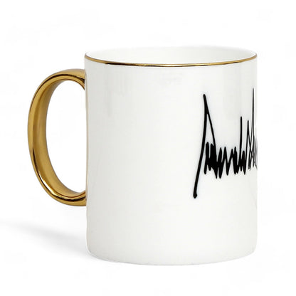 The ultimate Luxury Trump Signature Mug! A genuine Bone China Mug, featuring a gold handle and rim. (11 Oz)