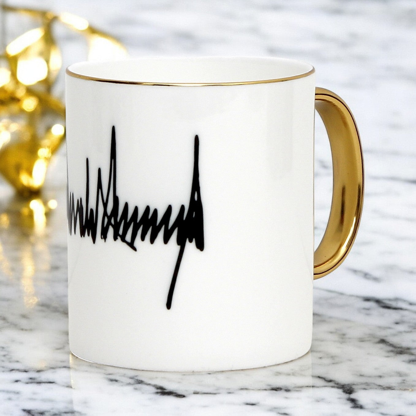 The ultimate Luxury Trump Signature Mug! A genuine Bone China Mug, featuring a gold handle and rim. (11 Oz)